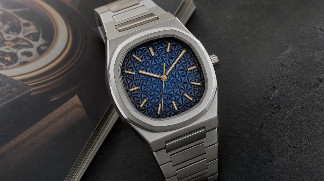 Stainless-steel sport-luxury watch with rounded-octagonal bezel and deep blue tropical embossed dial pattern